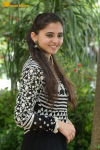 Tollywood actress preethi asrani in a black and white dress