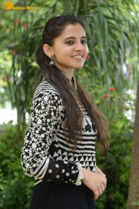 Tollywood actress preethi asrani in a black and white dress