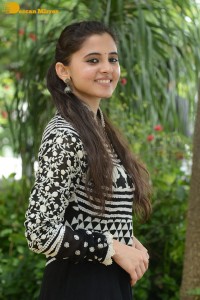 Tollywood actress preethi asrani in a black and white dress