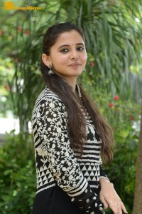 Tollywood actress preethi asrani in a black and white dress