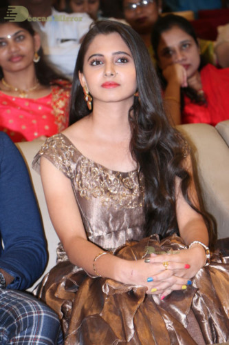 Telugu Actress Preethi Asrani in a gold colored dress attending a movie function