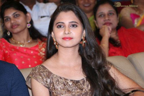 Telugu Actress Preethi Asrani in a gold colored dress attending a movie function