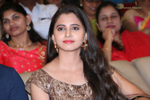 Telugu Actress Preethi Asrani in a gold colored dress attending a movie function