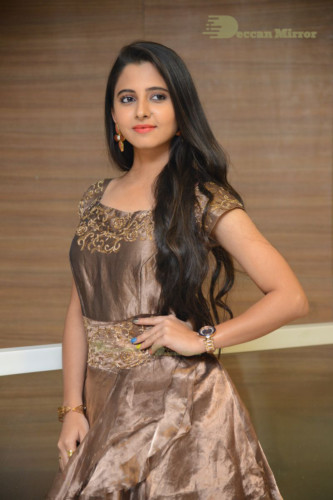 Telugu Actress Preethi Asrani in a gold colored dress attending a movie function