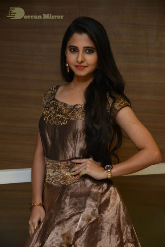 Telugu Actress Preethi Asrani in a gold colored dress attending a movie function