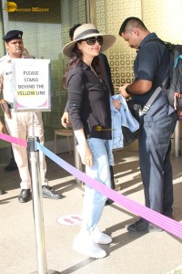 actress Preity Zinta in black shirt and blue denim jeans