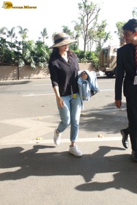 actress Preity Zinta in black shirt and blue denim jeans