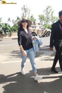 actress Preity Zinta in black shirt and blue denim jeans