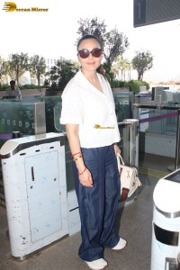 actress Preity Zinta in a white shirt and blue denim jeans