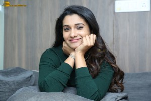 actress priya bhavani shankar in a green top and denim jeans