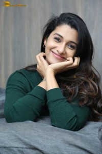 actress priya bhavani shankar in a green top and denim jeans