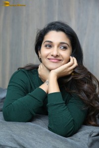 actress priya bhavani shankar in a green top and denim jeans