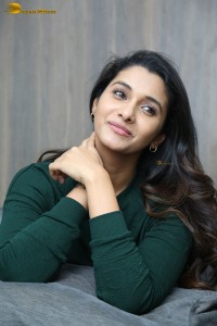 actress priya bhavani shankar in a green top and denim jeans