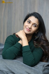 actress priya bhavani shankar in a green top and denim jeans