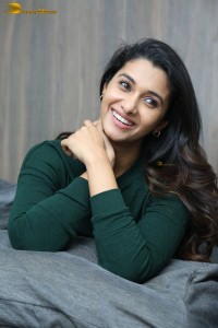 actress priya bhavani shankar in a green top and denim jeans