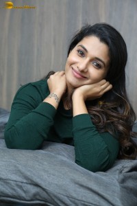 actress priya bhavani shankar in a green top and denim jeans