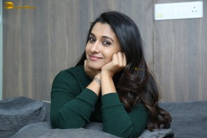 actress priya bhavani shankar in a green top and denim jeans