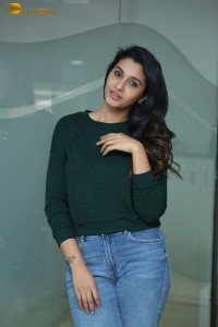 actress priya bhavani shankar in a green top and denim jeans