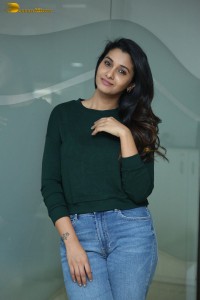 actress priya bhavani shankar in a green top and denim jeans