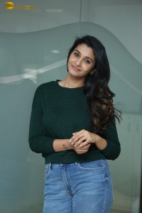 actress priya bhavani shankar in a green top and denim jeans