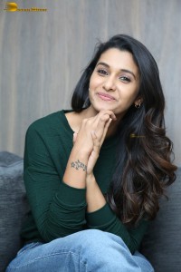 actress priya bhavani shankar in a green top and denim jeans