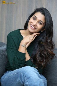 actress priya bhavani shankar in a green top and denim jeans