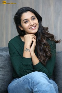 actress priya bhavani shankar in a green top and denim jeans