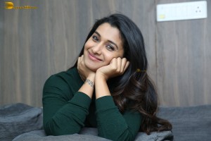 actress priya bhavani shankar in a green top and denim jeans