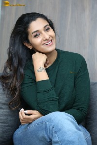 actress priya bhavani shankar in a green top and denim jeans