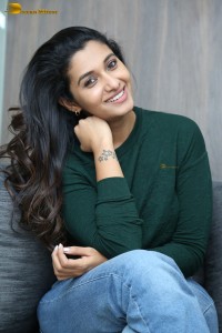 actress priya bhavani shankar in a green top and denim jeans