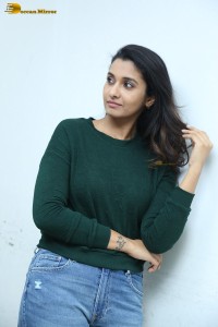 actress priya bhavani shankar in a green top and denim jeans