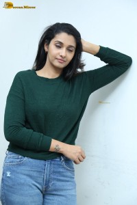 actress priya bhavani shankar in a green top and denim jeans