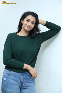 actress priya bhavani shankar in a green top and denim jeans
