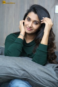 actress priya bhavani shankar in a green top and denim jeans