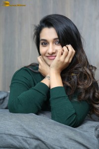 actress priya bhavani shankar in a green top and denim jeans