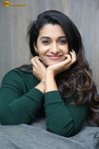 actress priya bhavani shankar in a green top and denim jeans