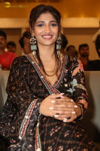 Actress Priya Vadlamani in a colorful black dress