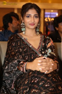 Actress Priya Vadlamani in a colorful black dress