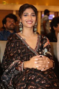 Actress Priya Vadlamani in a colorful black dress