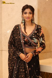 Actress Priya Vadlamani in a colorful black dress