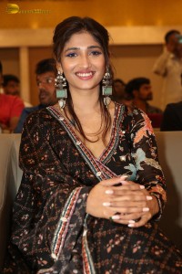 Actress Priya Vadlamani in a colorful black dress