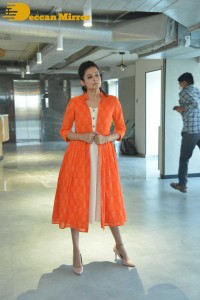 Priyamani photoshoot in a white dress and orange overall jacket