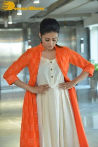Priyamani photoshoot in a white dress and orange overall jacket