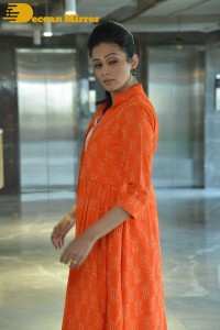 Priyamani photoshoot in a white dress and orange overall jacket