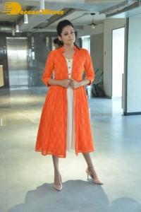 Priyamani photoshoot in a white dress and orange overall jacket