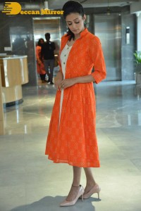 Priyamani photoshoot in a white dress and orange overall jacket