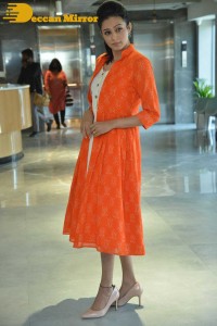 Priyamani photoshoot in a white dress and orange overall jacket