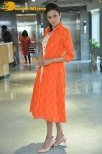 Priyamani photoshoot in a white dress and orange overall jacket