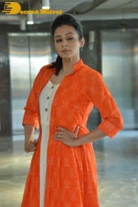 Priyamani photoshoot in a white dress and orange overall jacket