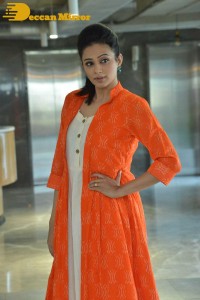 Priyamani photoshoot in a white dress and orange overall jacket